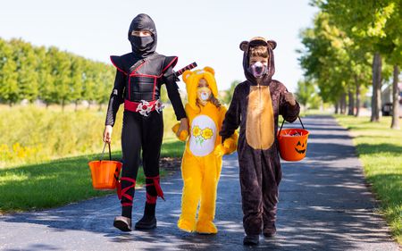 Hallowen Trick-or- Treaters wearing Covid masks